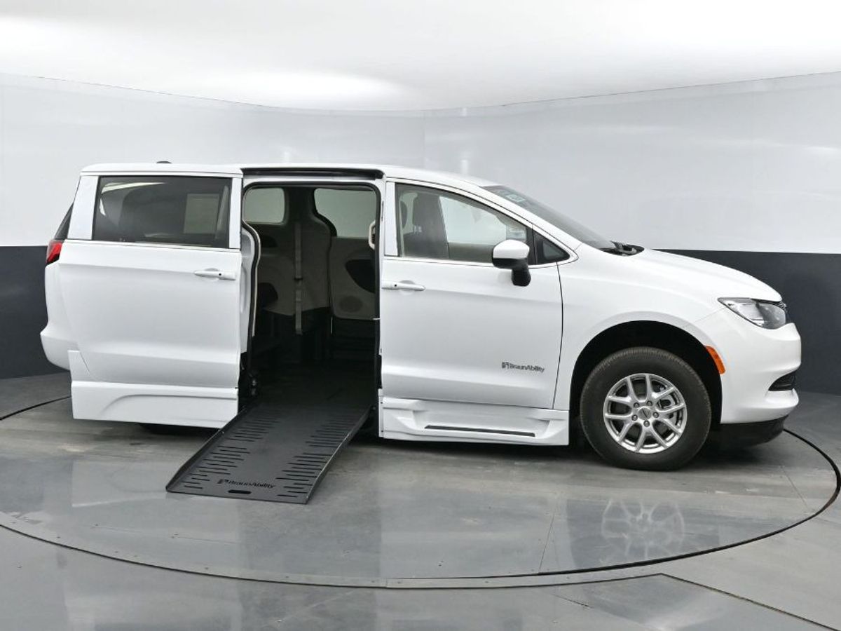 White Chrysler Voyager with BraunAbility Side Entry Automatic In Floor conversion