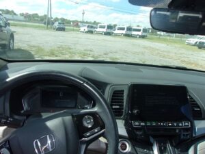 White Honda Odyssey with BraunAbility Side Entry Automatic In Floor conversion