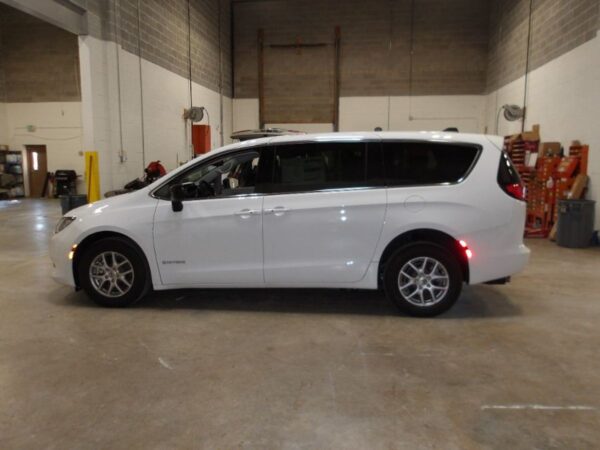 White Chrysler Voyager with Driverge Rear Entry Manual Fold Out conversion