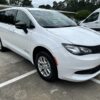 White Chrysler Voyager with BraunAbility Rear Entry Manual Fold Out conversion