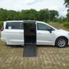 White Chrysler Voyager with Driverge Side Entry Automatic Fold Out conversion