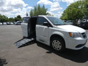 White Dodge Grand Caravan with BraunAbility Side Entry Manual Fold Out conversion