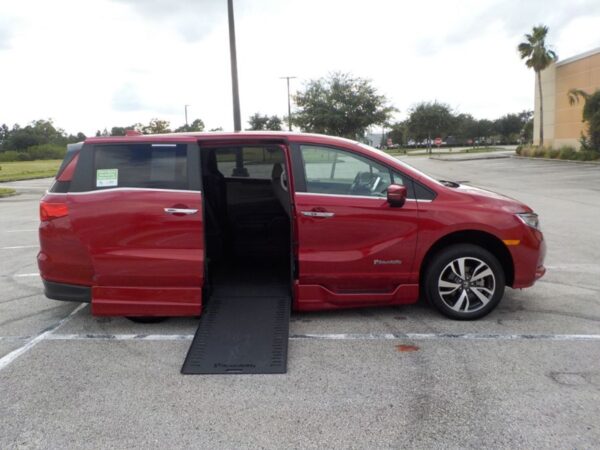 Red Honda Odyssey with BraunAbility Side Entry Automatic In Floor conversion