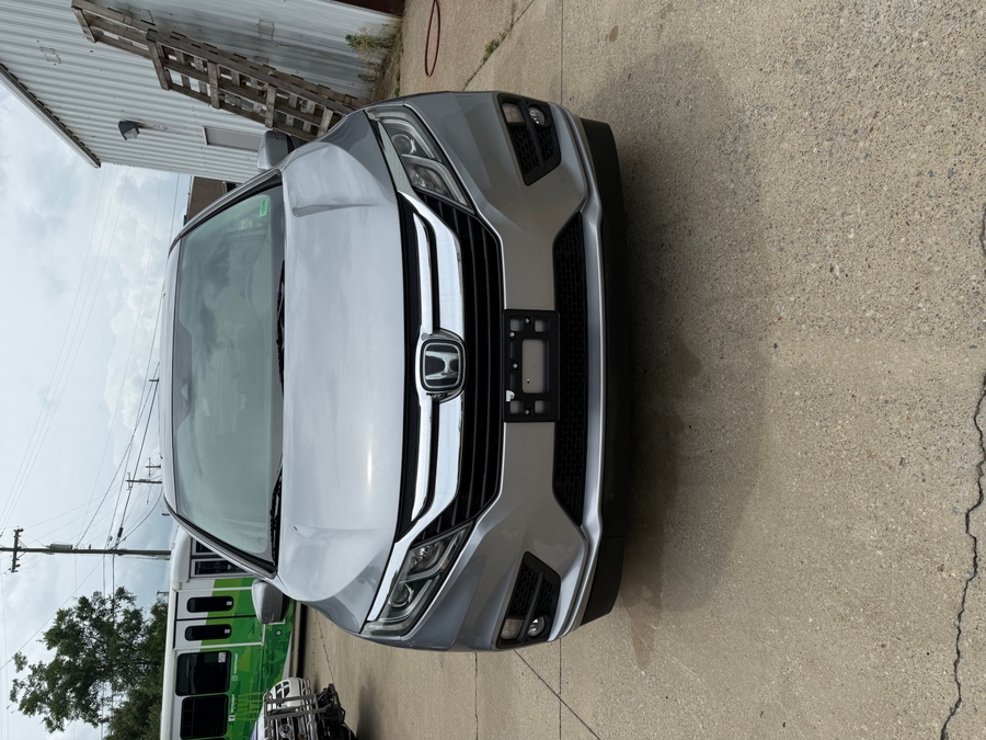 Silver Honda Odyssey with Vantage Mobility Side Entry Automatic In Floor conversion
