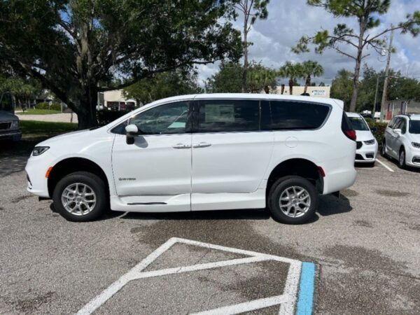 White Chrysler Pacifica with Driverge Side Entry Automatic Fold Out conversion