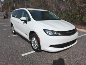 White Chrysler Voyager with BraunAbility Side Entry Manual Fold Out conversion