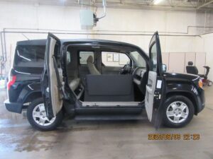 Black Honda Element with Freedom Motors Side Entry Manual Fold Out conversion