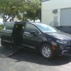 Black Chrysler Pacifica with Driverge Side Entry Automatic Fold Out conversion