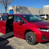 Red Honda Odyssey with BraunAbility Side Entry Automatic In Floor conversion