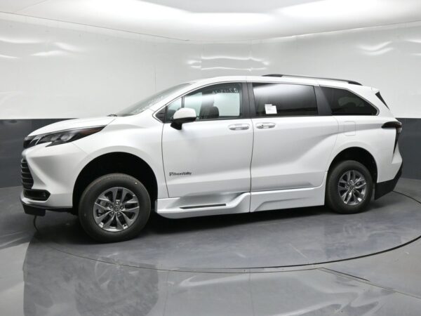 White Toyota Sienna with BraunAbility Side Entry Automatic Fold Out conversion