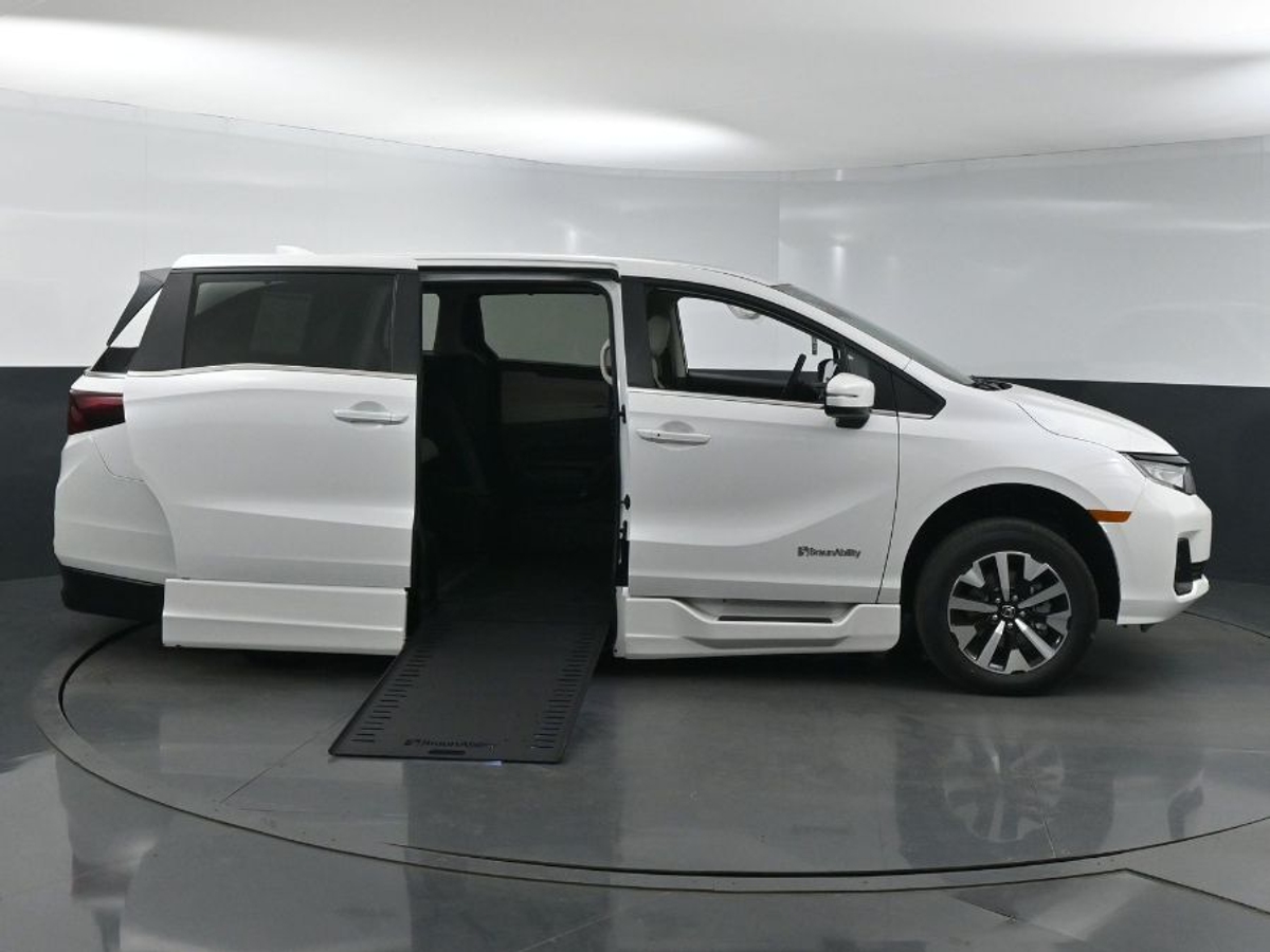 White Honda Odyssey with BraunAbility Side Entry Automatic In Floor conversion