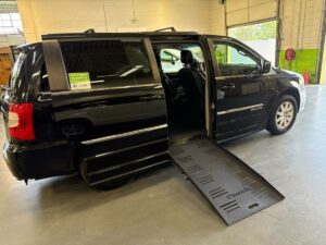Black Chrysler Town and Country with BraunAbility Side Entry Automatic Fold Out conversion