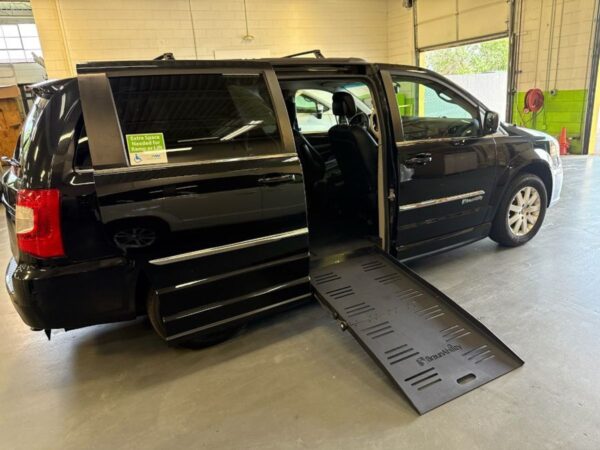 Black Chrysler Town and Country with BraunAbility Side Entry Automatic Fold Out conversion