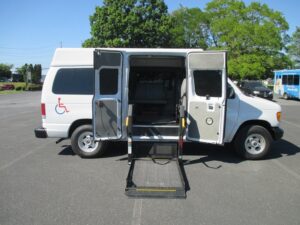 White Ford Econoline with Other Side Entry Automatic Fold Out conversion