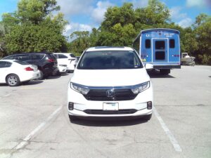 White Honda Odyssey with BraunAbility Side Entry Automatic In Floor conversion