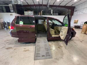 Red Honda Odyssey with BraunAbility Side Entry Automatic Fold Out conversion