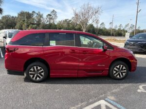 Red Honda Odyssey with BraunAbility Side Entry Automatic In Floor conversion