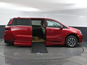 Red Honda Odyssey with BraunAbility Side Entry Automatic In Floor conversion