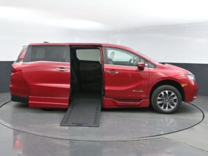 Red Honda Odyssey with BraunAbility Side Entry Automatic In Floor conversion