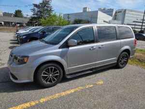 Silver Dodge Grand Caravan with Driverge Side Entry Automatic Fold Out conversion