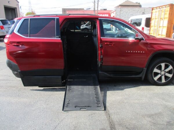 Red Chevrolet Traverse with BraunAbility Side Entry Automatic In Floor conversion