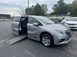 Silver Honda Odyssey with BraunAbility Side Entry Automatic In Floor conversion
