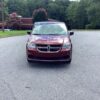 Red Dodge Grand Caravan with BraunAbility Side Entry Automatic Fold Out conversion