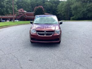 Red Dodge Grand Caravan with BraunAbility Side Entry Automatic Fold Out conversion