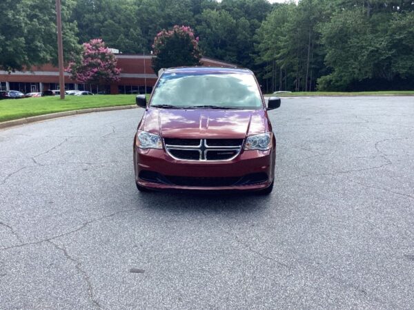 Red Dodge Grand Caravan with BraunAbility Side Entry Automatic Fold Out conversion