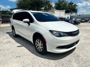 White Chrysler Voyager with BraunAbility Rear Entry Manual Fold Out conversion