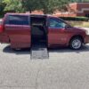 Red Dodge Grand Caravan with BraunAbility Side Entry Automatic Fold Out conversion