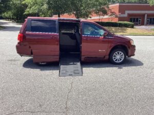 Red Dodge Grand Caravan with BraunAbility Side Entry Automatic Fold Out conversion