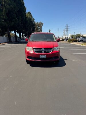 Red Dodge Grand Caravan with BraunAbility Side Entry Automatic Fold Out conversion