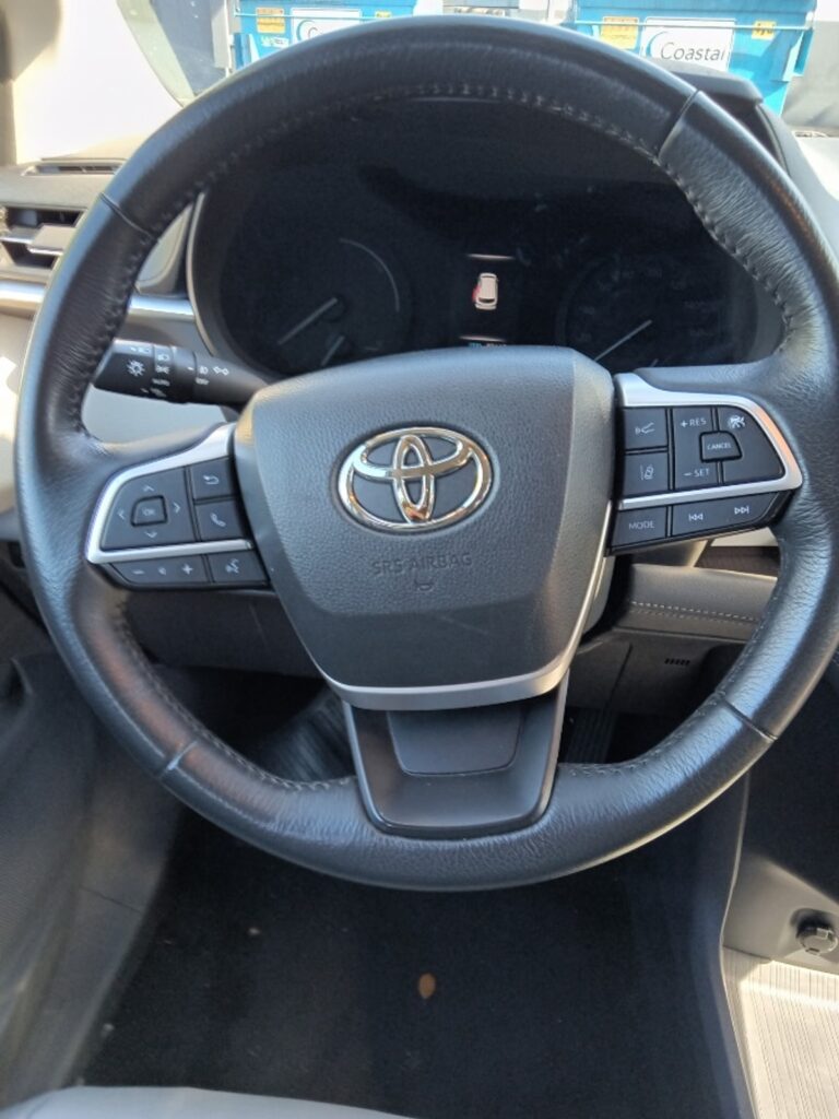 Silver Toyota Sienna with Driverge Rear Entry Manual Fold Out conversion