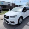 White Chrysler Pacifica with Driverge Side Entry Automatic Fold Out conversion