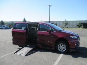 Red Chrysler Pacifica with BraunAbility Side Entry Automatic Fold Out conversion