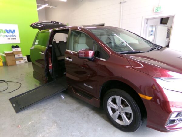 Red Honda Odyssey with BraunAbility Side Entry Automatic In Floor conversion