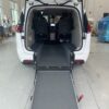 White Chrysler Pacifica with Driverge Rear Entry Manual Fold Out conversion