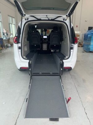 White Chrysler Pacifica with Driverge Rear Entry Manual Fold Out conversion