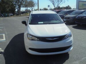 White Chrysler Voyager with Driverge Side Entry Automatic Fold Out conversion