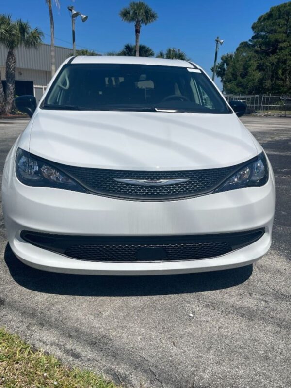 White Chrysler Voyager with Driverge Rear Entry Manual Fold Out conversion