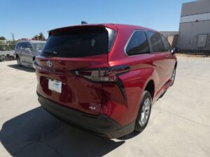 Red Toyota Sienna with BraunAbility Side Entry Automatic Fold Out conversion