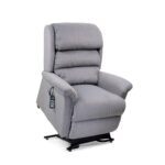 The Relaxer Lift Chair is a gray upholstered recliner with padded armrests and backrest, plus a remote control attached to the side.
