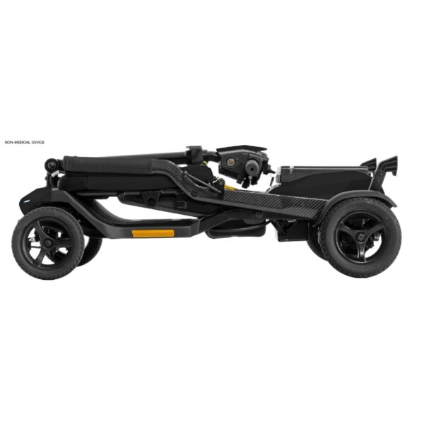 A sleek, lightweight travel scooter, this folded black Go Go® Super Portable model with four wheels is viewed from the side.