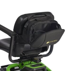 A Golden Tech Universal Travel Case is attached to the back of a mobility scooter seat. The bags flap is open, revealing its interior and displaying the Golden logo.