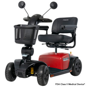 A red and black mobility scooter with a front basket, padded seat, armrests, and two rearview mirrors.